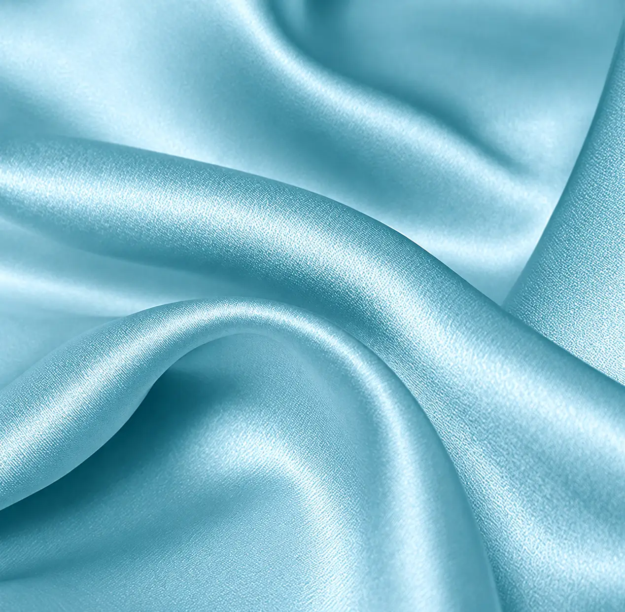 Light blue silk stretch satin fabric showing smooth texture and drape