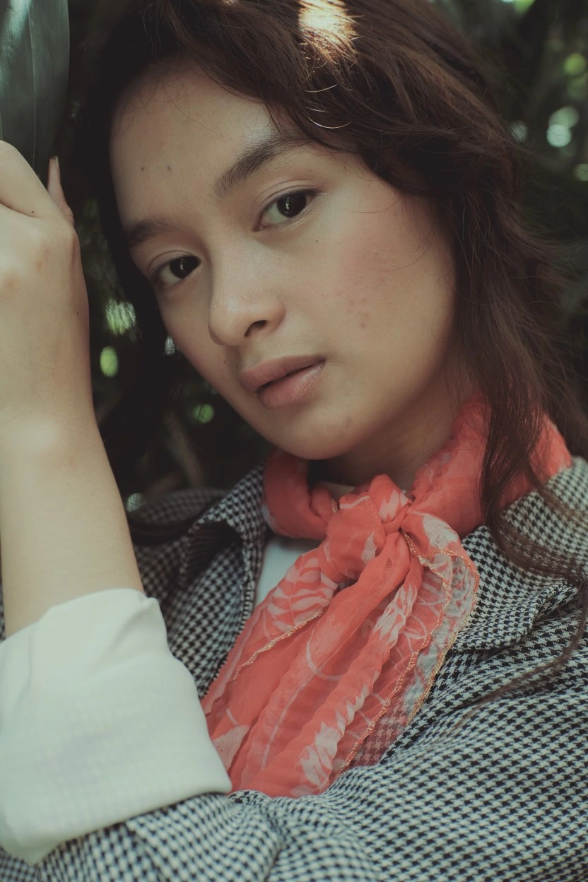 Woman wearing a neck scarf showing drape and styling